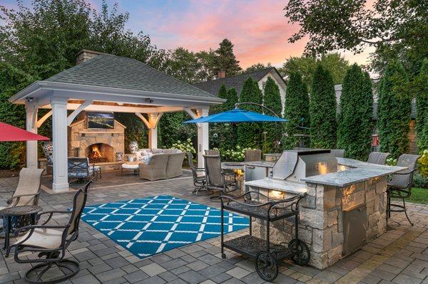 The Ville Team | Backyard stone kitchen and gazebo with fireplace at home for sale | Naperville, Illinois Top Real Estate Team