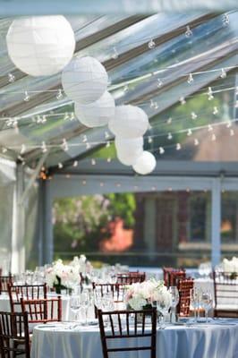 Paper Lanterns Attached to Bistros in a Clear Frame Tent