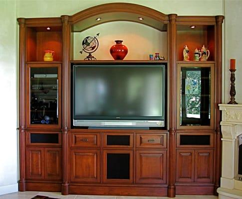 Custom Cherry built in media center designed and handcrafted by Philip Snyder of PS Woodworking features a graceful arch, rou...