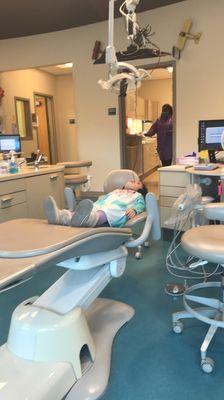 They have little TVs mounted for kids to watch while they wait for the dentist so they aren't laying there anticipating the worst.