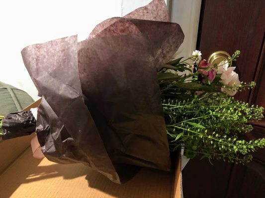 flower arrangement in brown tissue paper