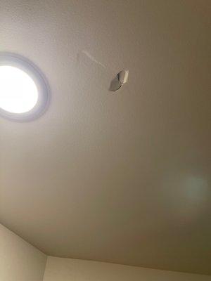 Hole in ceiling of brand new home.