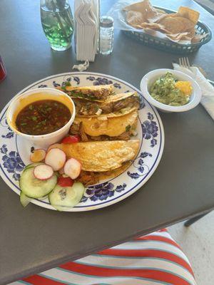 Birria and Consume with made to order guacamole and fresh chips