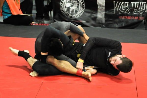 10th Planet Beaumont instructor Brian Debes wins a grappling competition with an "Electric Triangle Choke" AKA "Leg in triangle"