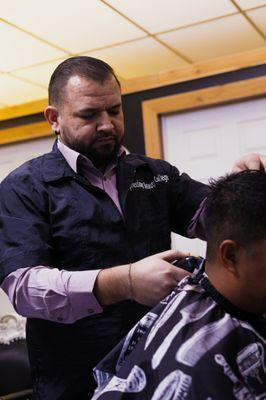 Student Performing A Haircut!