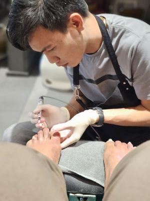 Ken at work on my feet