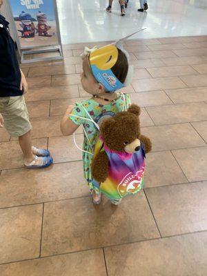 Birthday bear in a backpack.