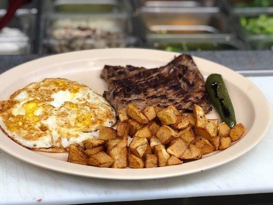 Steak and eggs with home fries