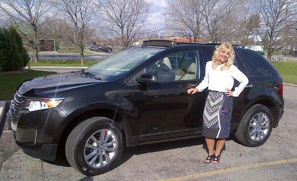 Peggy Scorse, Spencerport, NY with her Ford Edge SEL obtained through AutoWise.