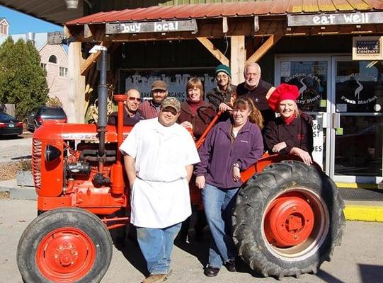 Owner Steve Burzon and employees with some of the local farmers and food producers who sell their products in the Fresh Market.