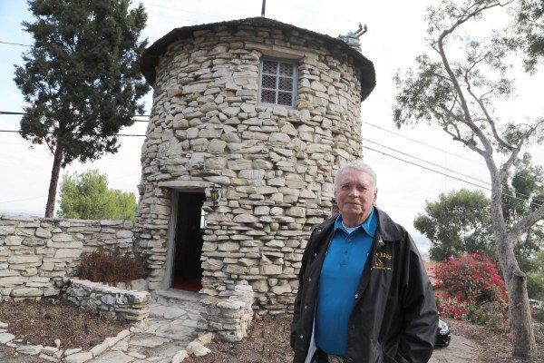 John Doty has lived as the caretaker of a tiny stone tower overlooking the ocean in Palos Verdes Estates. Photo By Chuck Bennett