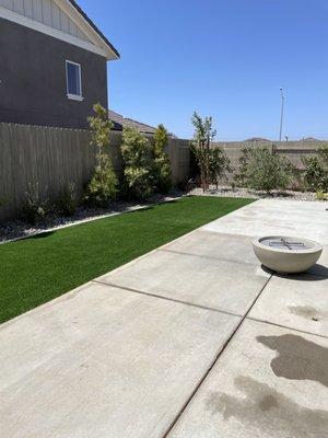 Turf , rock, fire pit, and plants