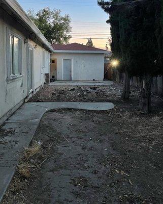 After photo, all trash removed; deck and shed demoed