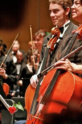 Santa Cruz Symphony cellists Shane Carrasco and Ellen Sanders standing for applause.  (photo by Dina Scoppettone)