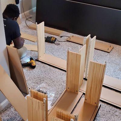 My son building drawers for bed