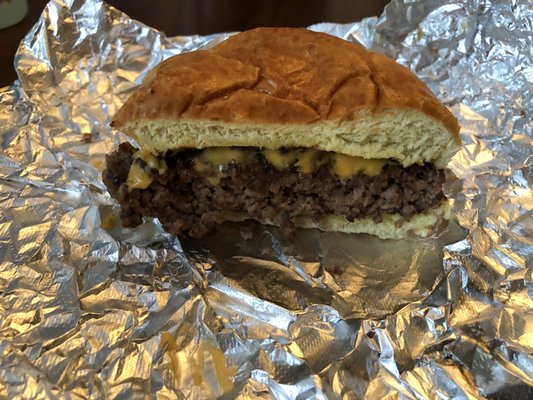 Side view of cheeseburger w/lettuce only (no tomato/mayo)