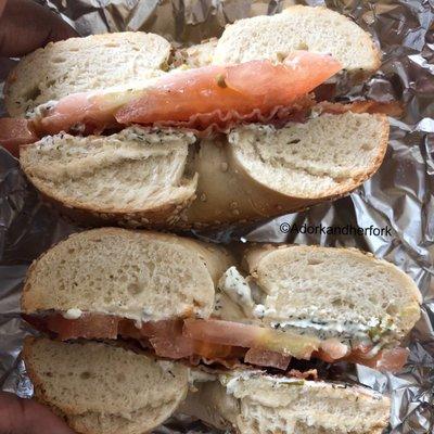 Bacon, tomato, chive cream cheese on a sesame seed bagel