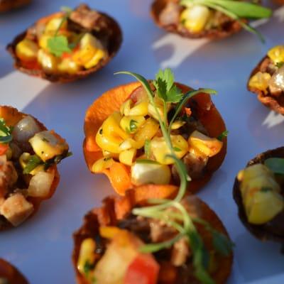 Sweet potato crisps with braised chicken and roasted corn salsa are a great tray-passed hors d'oeuvre