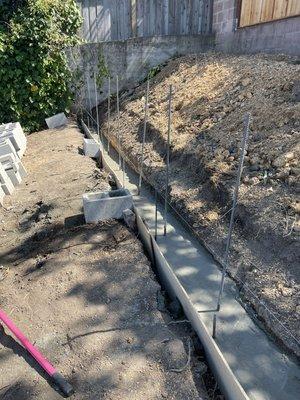 Footing for retaining wall