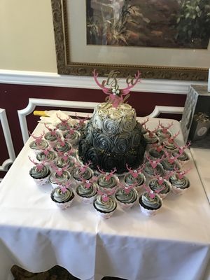 Ombré 3-tier baby shower cake with cupcakes