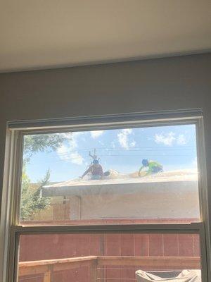 Workers looking into living room