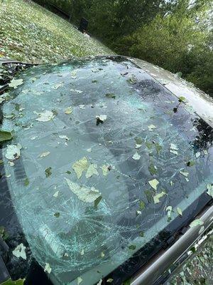 Broken windshield of the gold car that was 6 feet to the left of my Sea-Doo during the hail storm.