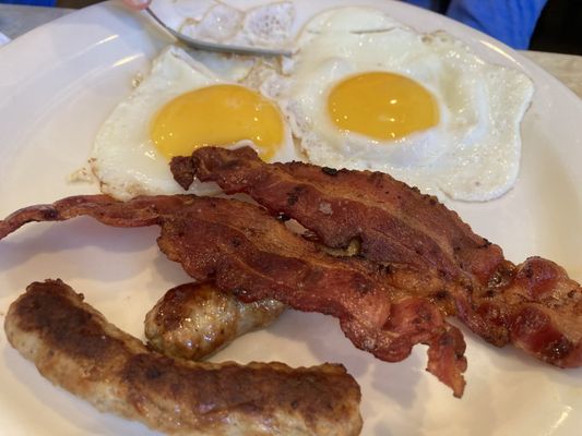 Perfect sunny side up eggs with bacon and sausage