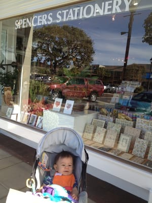 In front of the store's lovely display window