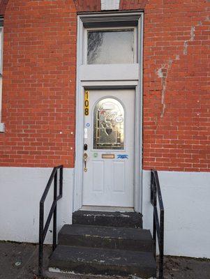 This bike-sticker-clad door seemed to the (old?) entrance