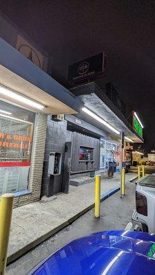 It's right here between the liquor store and the auto parts store. Yes they have an authentic payphone out front too!