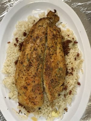 Baked fish over buttered rice