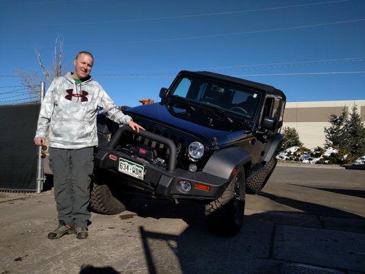 Happy customer picking up his Jeep!