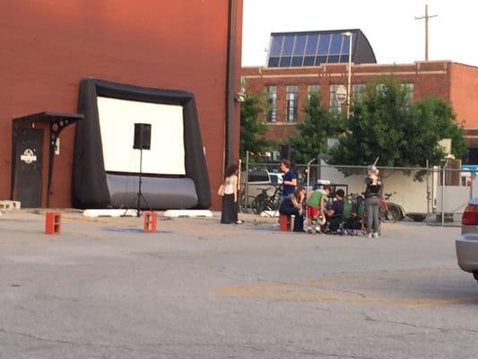 Setting up for outdoor movie in parking lot during Premiere