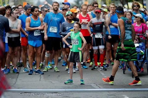 Wearing...(and yawning waiting for the start of the race*), number "2004" denoting the youngest runner in the event.....destined for his