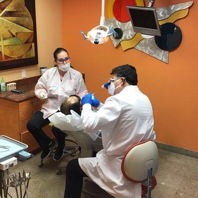 Dr. Farsio doing endodontic exam.