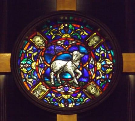 Stained glass window in the center of the cross above the alter