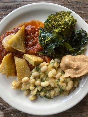 Roasted Ulu (breadfruit) in marinera sauce with cannelini beans in a fennel lilikoi sauce, sautéed roasted greens and jackfruit hummus.