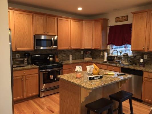 Add small kitchen island, new recess lights and backsplash.