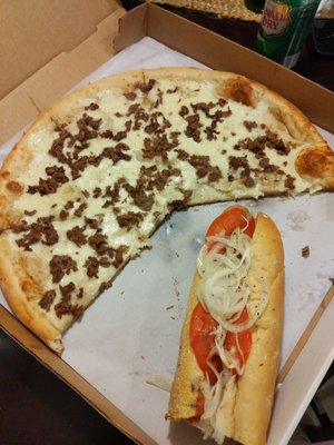 The zach pizza and half uneaten cheese steak zep