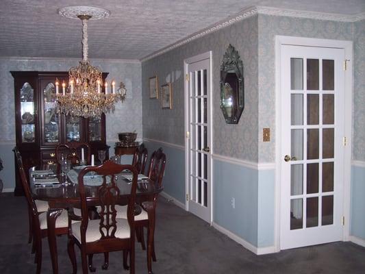 Installed the chandelier & medallion, wallpaper, chair rail, crown molding and French doors.  Painted walls and trim.