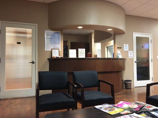 Reception desk and doors to the exam rooms in the back.