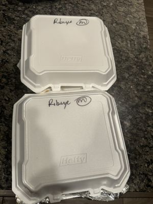 Container for two ribeyes with an M for medium.