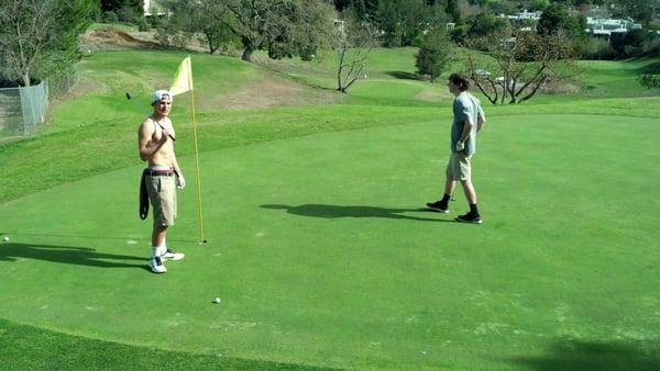 Some kids playing golf on the 4th hole