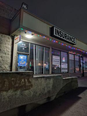 Front entrance of the business at night time.