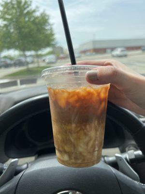 Iced macchiato with pumpkin and oat milk.