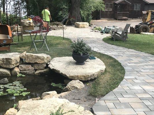 Water feature slate stone walkway and a fire pit