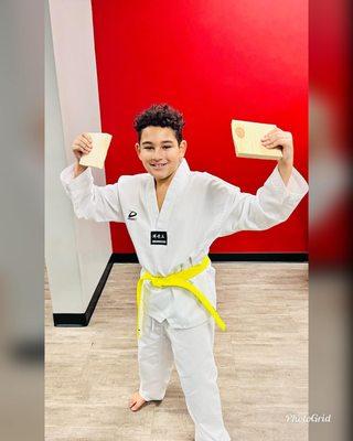 Taekwondo student board break