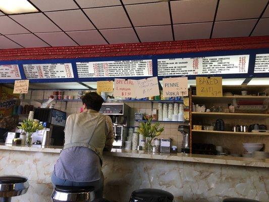 Photo of the counter and the posted menu