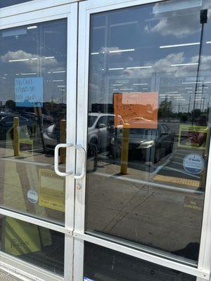 "Restroom break" sign with doors locked, yet there are two ladies inside shopping??