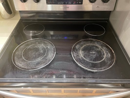 Uncleaned stove upon arrival